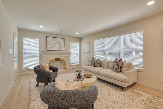 1109 NE 17th St, Oklahoma City, OK 73111 - living room featuring light wood-style floors, recessed lighting, and a fireplace with flush hearth
