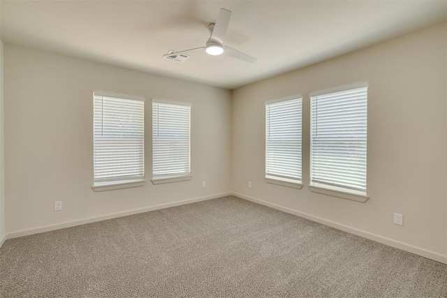 1109 NE 17th St, Oklahoma City, OK 73111 - spare room with light colored carpet and a ceiling fan