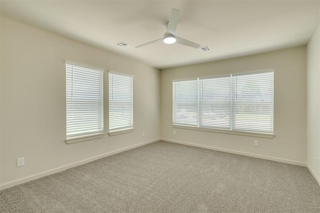1109 NE 17th St, Oklahoma City, OK 73111 - carpeted spare room with baseboards and a ceiling fan