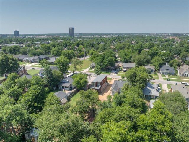 1134 NW 40th St, Oklahoma City, OK 73118 - aerial perspective of suburban area featuring a tree filled landscape