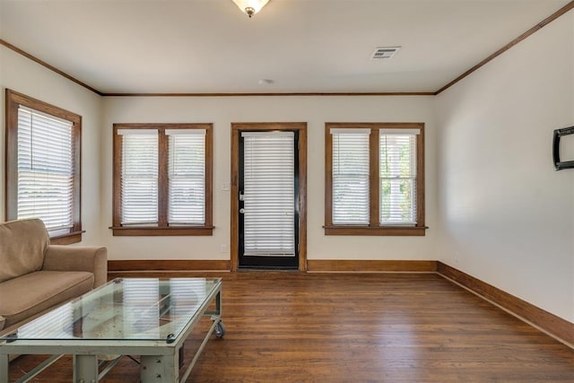 1134 NW 40th St, Oklahoma City, OK 73118 - living room featuring dark wood-style flooring and crown molding