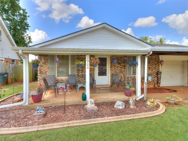 3900 Chetwood Dr, Del City, OK 73115 - ranch-style home with a porch, brick siding, and an attached garage