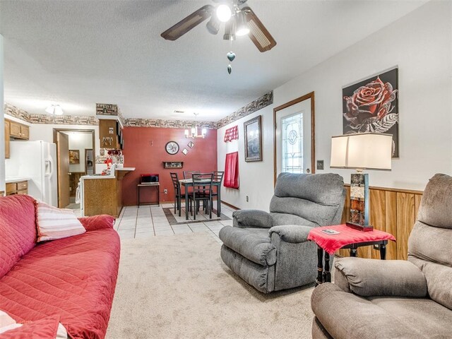 3900 Chetwood Dr, Del City, OK 73115 - living room featuring ceiling fan, a chandelier, and light tile patterned flooring