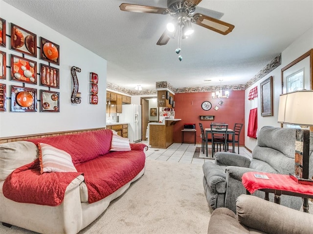 3900 Chetwood Dr, Del City, OK 73115 - living room with a ceiling fan, a chandelier, a textured ceiling, and light tile patterned floors