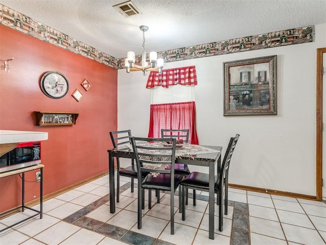 3900 Chetwood Dr, Del City, OK 73115 - tiled dining room with a chandelier and a textured ceiling