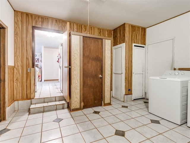 3900 Chetwood Dr, Del City, OK 73115 - laundry area featuring washer / clothes dryer, wooden walls, and light tile patterned floors