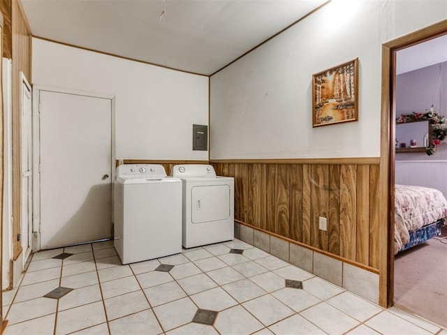 3900 Chetwood Dr, Del City, OK 73115 - laundry area featuring washer and dryer, wainscoting, electric panel, and wooden walls