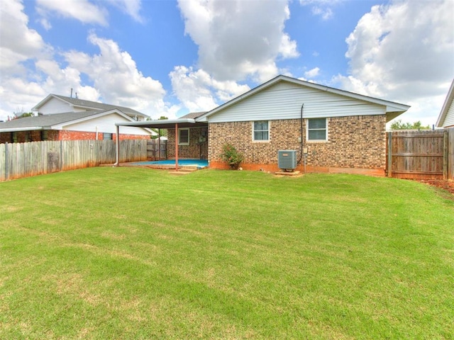 3900 Chetwood Dr, Del City, OK 73115 - back of property featuring a fenced backyard and brick siding
