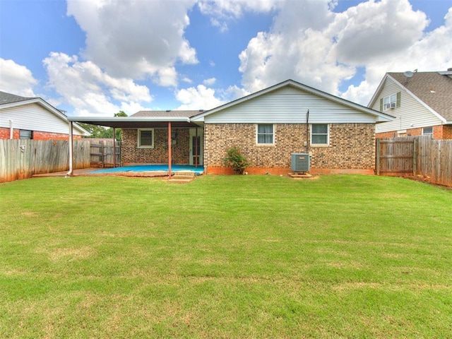 3900 Chetwood Dr, Del City, OK 73115 - back of property with a fenced backyard and brick siding