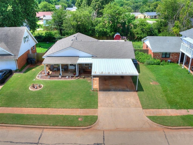 3900 Chetwood Dr, Del City, OK 73115 - view of front of home with driveway, an attached carport, and a front lawn