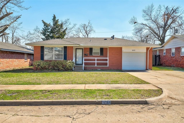 220 E 31st St, Edmond, OK 73013 - single story home with a garage, driveway, a front yard, and brick siding