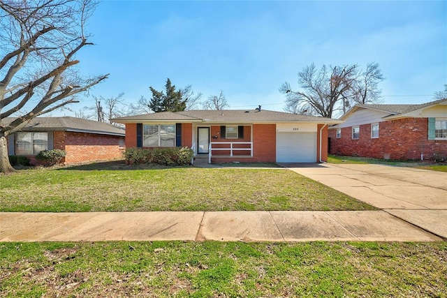 220 E 31st St, Edmond, OK 73013 - ranch-style house with a garage, brick siding, driveway, and a front lawn