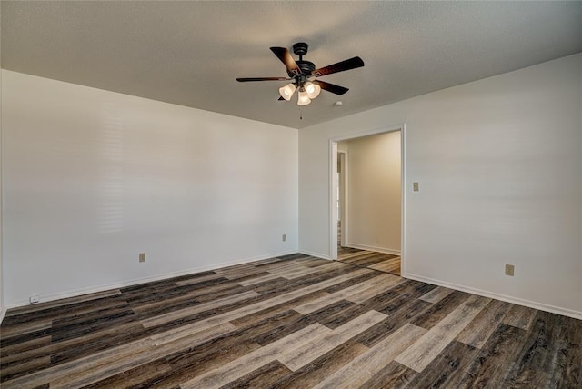 220 E 31st St, Edmond, OK 73013 - unfurnished room with dark wood finished floors and ceiling fan