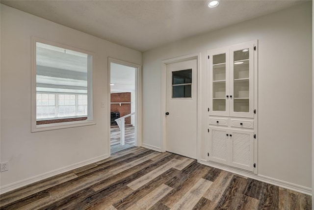 220 E 31st St, Edmond, OK 73013 - unfurnished dining area with dark wood finished floors and recessed lighting