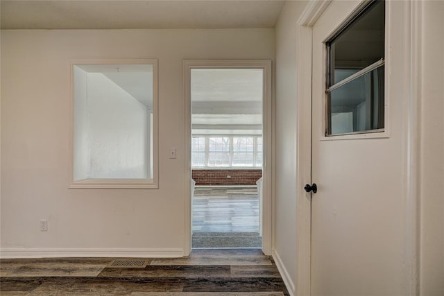 220 E 31st St, Edmond, OK 73013 - hall with dark wood-type flooring and baseboards