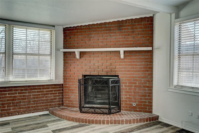220 E 31st St, Edmond, OK 73013 - detailed view of wood finished floors and a brick fireplace
