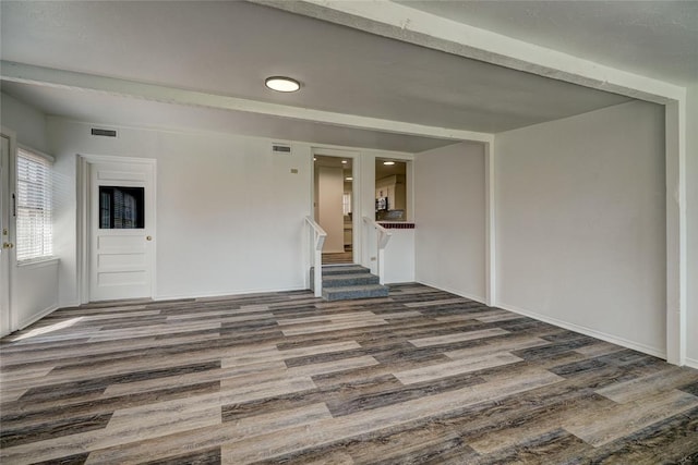 220 E 31st St, Edmond, OK 73013 - unfurnished room with wood finished floors, recessed lighting, and stairway