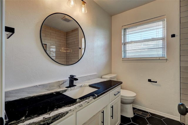 220 E 31st St, Edmond, OK 73013 - bathroom with vanity and tile patterned flooring