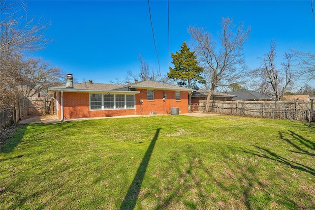 220 E 31st St, Edmond, OK 73013 - rear view of house with brick siding, a fenced backyard, and a gate