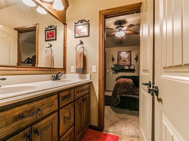 13120 NW 4th St, Yukon, OK 73099 - bathroom with double vanity, ensuite bathroom, and a ceiling fan