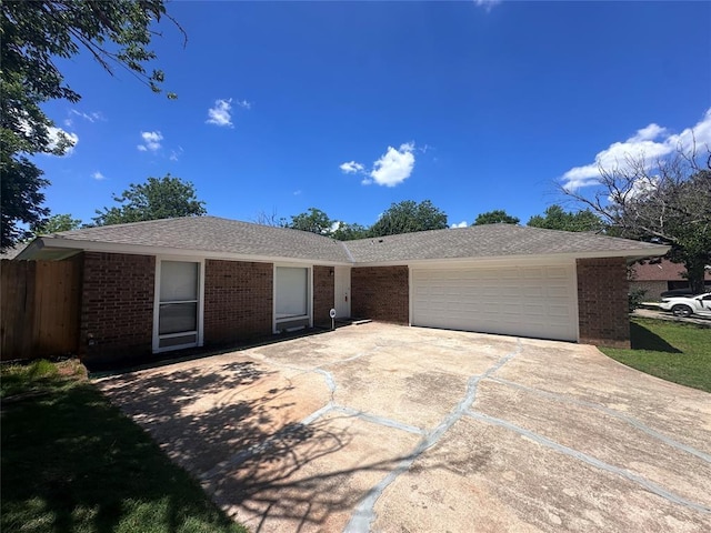 6708 Lyrewood Cir, Oklahoma City, OK 73132 - ranch-style home with brick siding, a garage, and concrete driveway
