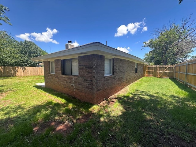 6708 Lyrewood Cir, Oklahoma City, OK 73132 - view of side of property with brick siding, a chimney, and a fenced backyard