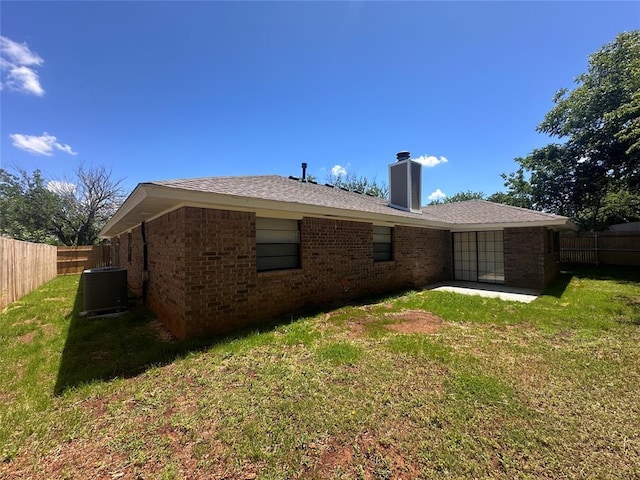 6708 Lyrewood Cir, Oklahoma City, OK 73132 - back of property featuring brick siding, a chimney, and a patio area
