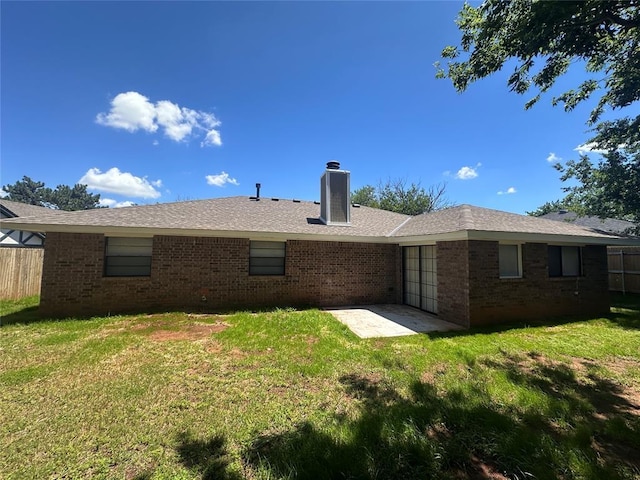 6708 Lyrewood Cir, Oklahoma City, OK 73132 - back of house with brick siding, a chimney, and a patio