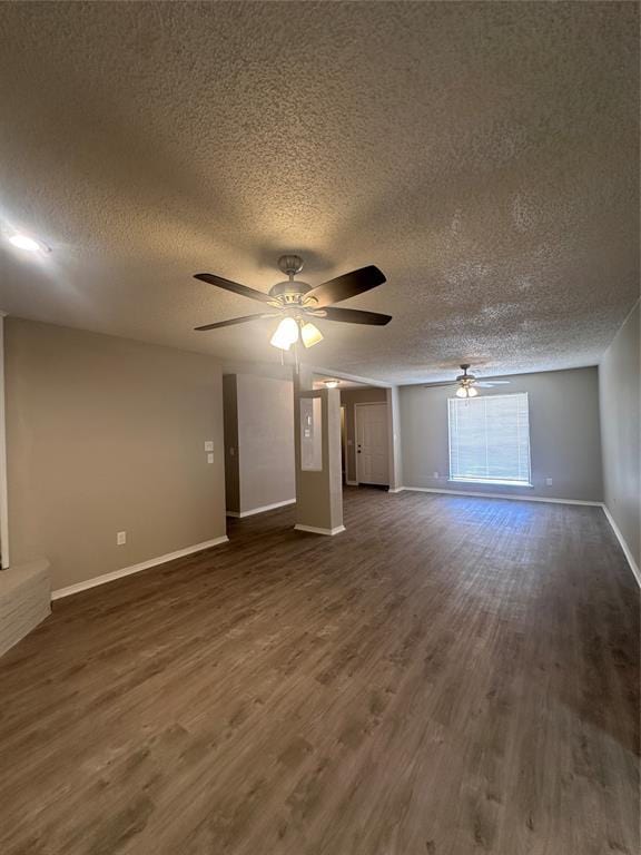 6708 Lyrewood Cir, Oklahoma City, OK 73132 - empty room featuring a textured ceiling, ceiling fan, and dark wood-style floors