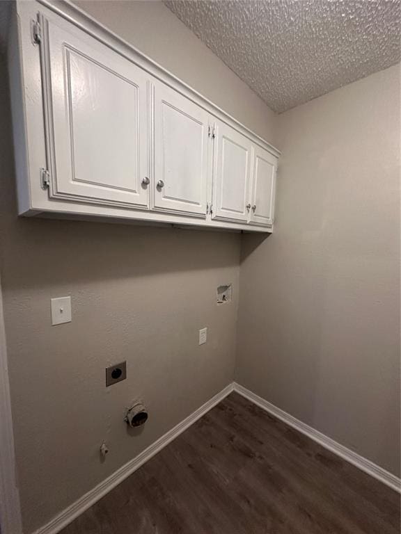 6708 Lyrewood Cir, Oklahoma City, OK 73132 - laundry area with hookup for an electric dryer, dark wood finished floors, cabinet space, a textured ceiling, and hookup for a gas dryer