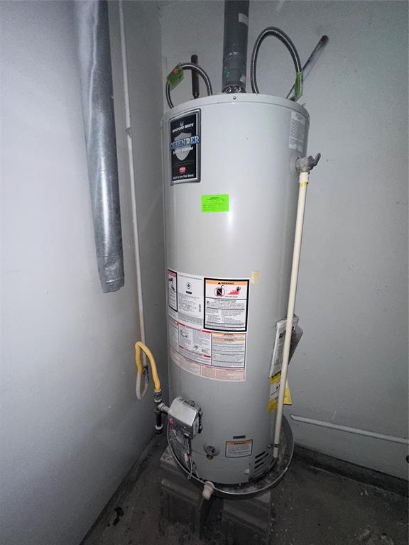 6708 Lyrewood Cir, Oklahoma City, OK 73132 - utility room featuring water heater