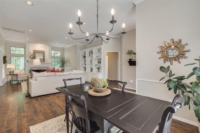 2801 Brixton Rd, Edmond, OK 73034 - dining area with a chandelier, crown molding, dark wood-type flooring, and recessed lighting