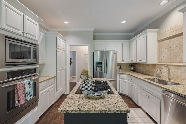 2801 Brixton Rd, Edmond, OK 73034 - kitchen featuring stainless steel appliances, white cabinetry, dark wood-style flooring, crown molding, and backsplash