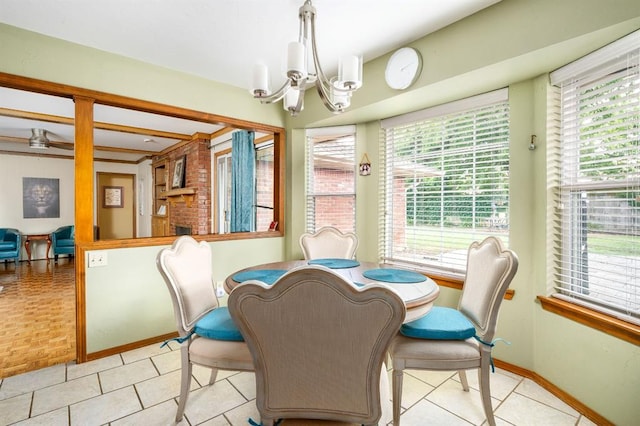 2504 NW 119th St, Oklahoma City, OK 73120 - dining room featuring a chandelier, plenty of natural light, and tile patterned flooring