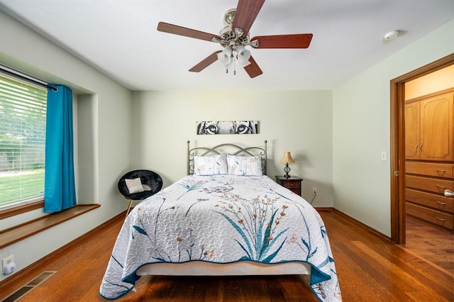 2504 NW 119th St, Oklahoma City, OK 73120 - bedroom with wood finished floors and a ceiling fan