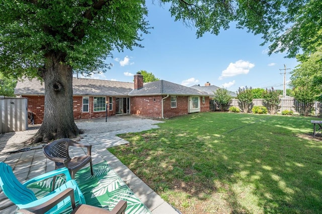 2504 NW 119th St, Oklahoma City, OK 73120 - fenced backyard featuring a patio area