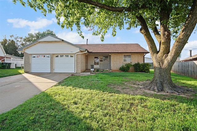 3913 SE 14th Pl, Oklahoma City, OK 73115 - single story home featuring brick siding, a garage, and concrete driveway