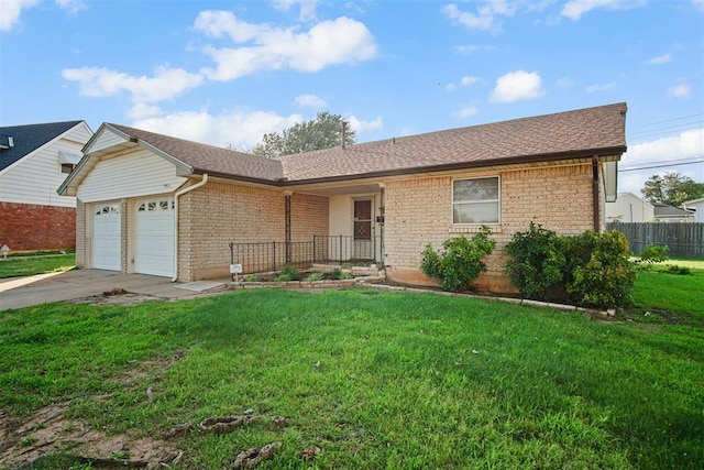 3913 SE 14th Pl, Oklahoma City, OK 73115 - ranch-style house featuring a garage, brick siding, and driveway