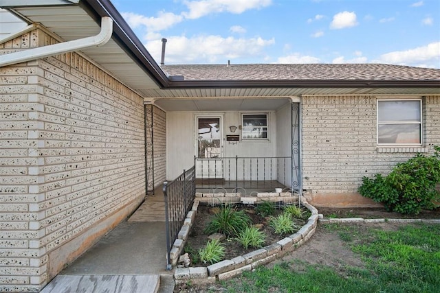 3913 SE 14th Pl, Oklahoma City, OK 73115 - entrance to property featuring brick siding and roof with shingles