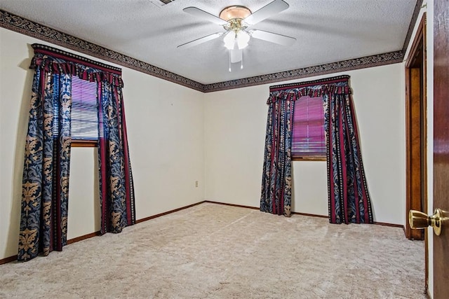 3913 SE 14th Pl, Oklahoma City, OK 73115 - unfurnished room with a textured ceiling, carpet floors, and a ceiling fan