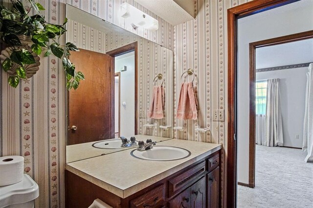 3913 SE 14th Pl, Oklahoma City, OK 73115 - bathroom featuring wallpapered walls and vanity