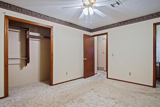 3913 SE 14th Pl, Oklahoma City, OK 73115 - unfurnished bedroom with carpet floors, a textured ceiling, a closet, and ceiling fan