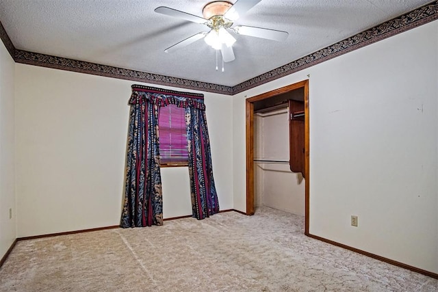 3913 SE 14th Pl, Oklahoma City, OK 73115 - unfurnished bedroom featuring carpet, a textured ceiling, and a ceiling fan