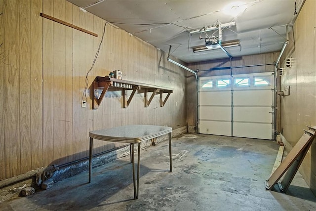 3913 SE 14th Pl, Oklahoma City, OK 73115 - garage with wood walls and a garage door opener
