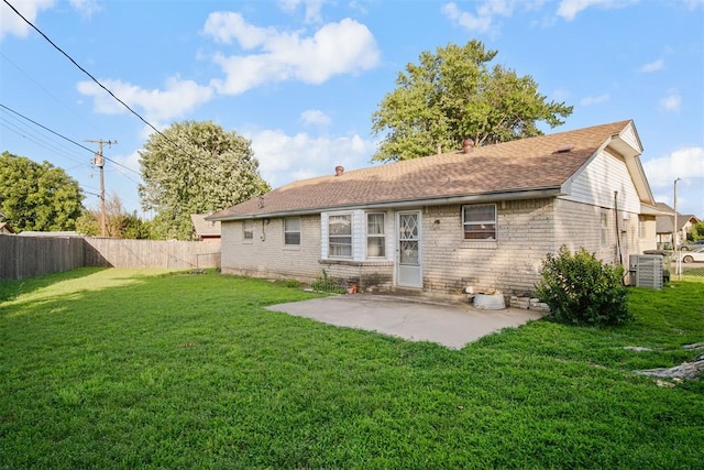 3913 SE 14th Pl, Oklahoma City, OK 73115 - back of house featuring a patio, brick siding, and a shingled roof