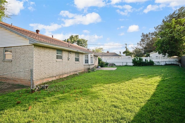 3913 SE 14th Pl, Oklahoma City, OK 73115 - fenced backyard with a patio area