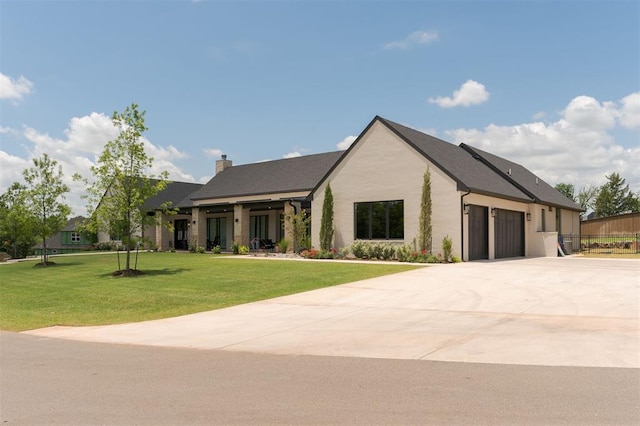 501 Old Creek Rd, Edmond, OK 73034 - view of front of house with an attached garage, driveway, a chimney, a front lawn, and stucco siding