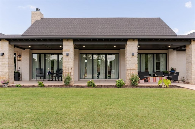 501 Old Creek Rd, Edmond, OK 73034 - rear view of house featuring a yard, a chimney, a patio area, and roof with shingles