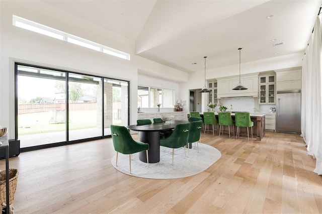 501 Old Creek Rd, Edmond, OK 73034 - dining room with high vaulted ceiling and light wood-style flooring