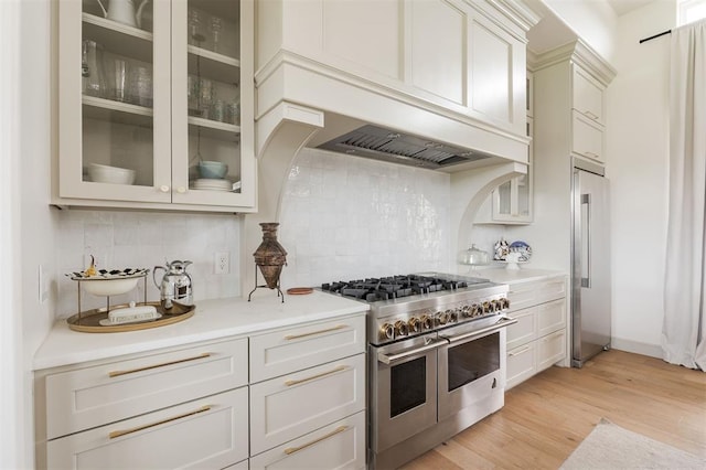 501 Old Creek Rd, Edmond, OK 73034 - kitchen with high end appliances, light countertops, and decorative backsplash
